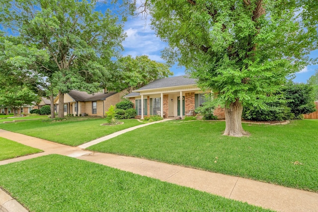 3909 Commonwealth Dr, Flower Mound, TX 75028 - view of front of house featuring a front lawn and brick siding