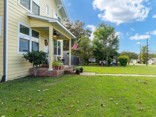 1056 Park Dr, Hillsboro, TX 76645 - view of grassy yard with ceiling fan and covered porch