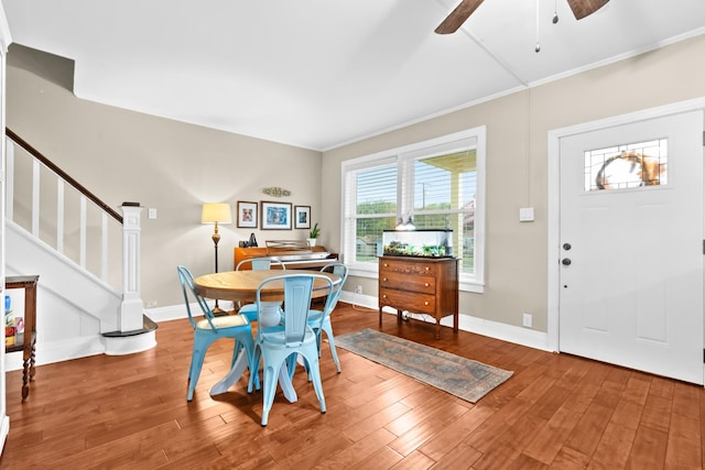 1056 Park Dr, Hillsboro, TX 76645 - dining area featuring ceiling fan, wood finished floors, ornamental molding, and stairway