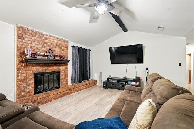 3102 Primrose Dr, Abilene, TX 79606 - living area featuring wood finished floors, a ceiling fan, and a brick fireplace