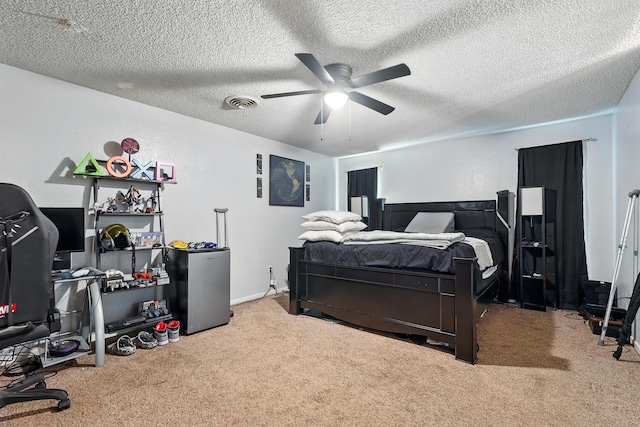 3102 Primrose Dr, Abilene, TX 79606 - bedroom with carpet, freestanding refrigerator, a textured ceiling, and a ceiling fan