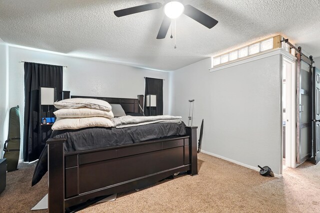 3102 Primrose Dr, Abilene, TX 79606 - bedroom with carpet, a textured ceiling, and a ceiling fan