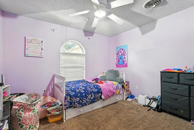 3102 Primrose Dr, Abilene, TX 79606 - bedroom with carpet, a textured ceiling, and a ceiling fan