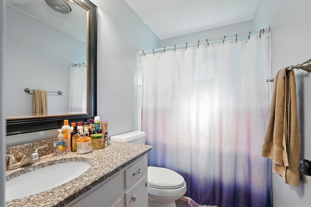 3102 Primrose Dr, Abilene, TX 79606 - bathroom featuring vanity, a textured ceiling, and a shower with shower curtain