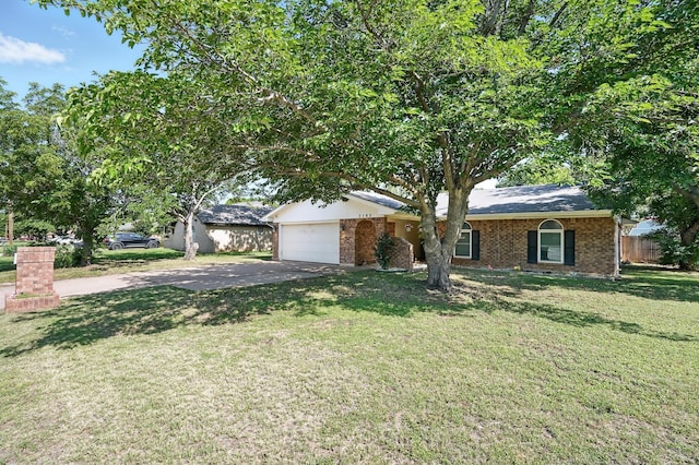 3102 Primrose Dr, Abilene, TX 79606 - view of front of house featuring driveway, an attached garage, and brick siding