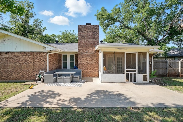 3102 Primrose Dr, Abilene, TX 79606 - back of house featuring a patio, a chimney, a sunroom, brick siding, and french doors