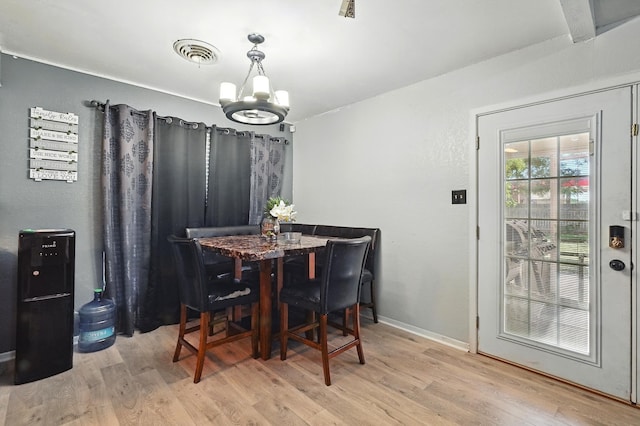 3102 Primrose Dr, Abilene, TX 79606 - dining space with a chandelier and wood finished floors