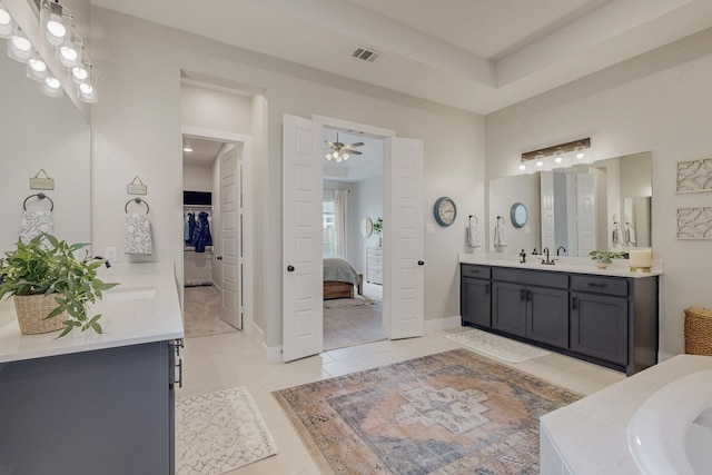 2801 Capitol Pl, Melissa, TX 75454 - bathroom with two vanities, ceiling fan, tile patterned floors, and connected bathroom