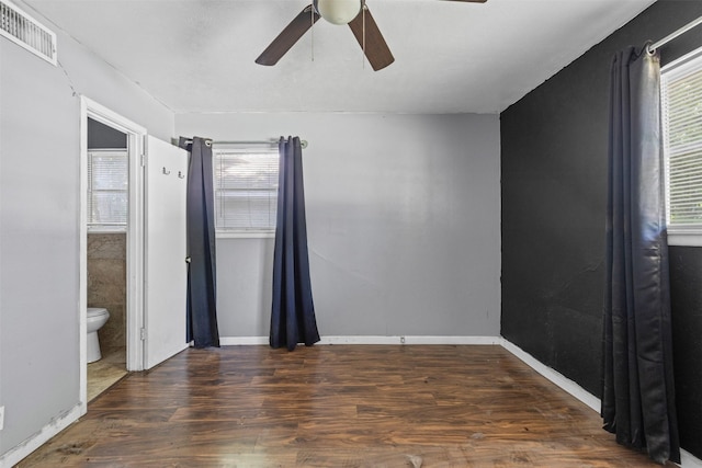 3312 Henry Dr, Richland Hills, TX 76118 - unfurnished bedroom featuring wood finished floors, ensuite bathroom, and ceiling fan
