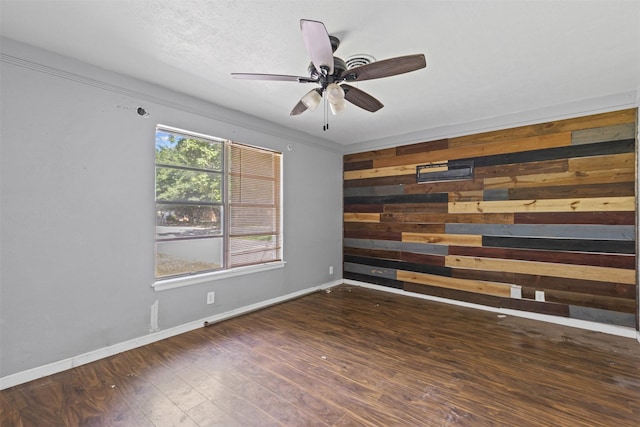 3312 Henry Dr, Richland Hills, TX 76118 - unfurnished room featuring wooden walls, wood finished floors, and a ceiling fan