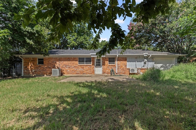 3312 Henry Dr, Richland Hills, TX 76118 - back of house with brick siding, a yard, an attached garage, and a patio