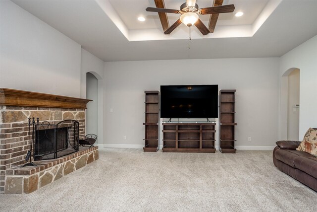 103 Loving Trl, Justin, TX 76247 - carpeted living room with arched walkways, a ceiling fan, a raised ceiling, and recessed lighting
