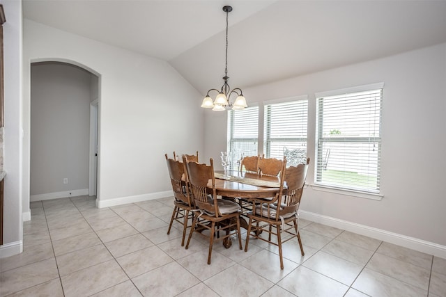 103 Loving Trl, Justin, TX 76247 - dining area with arched walkways, vaulted ceiling, light tile patterned floors, and a chandelier