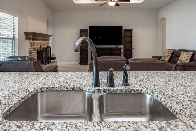 103 Loving Trl, Justin, TX 76247 - detailed view of ceiling fan, carpet floors, and a fireplace