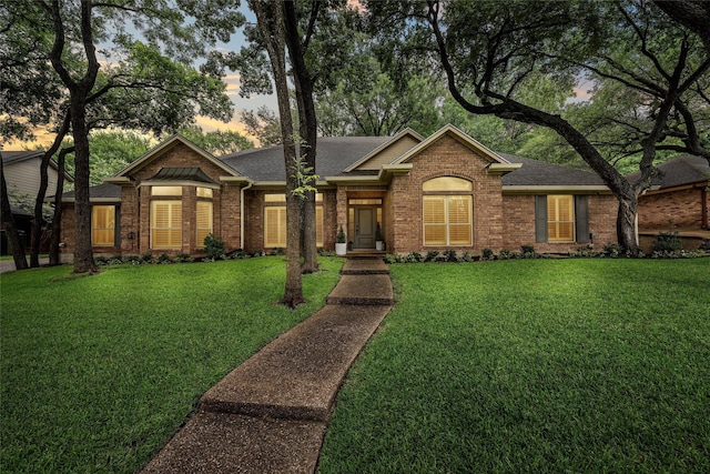 9604 Oak Springs Dr, Woodway, TX 76712 - view of front of property featuring brick siding, a yard, and roof with shingles