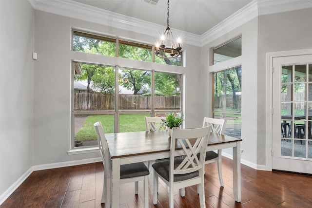 9604 Oak Springs Dr, Woodway, TX 76712 - dining room featuring plenty of natural light, ornamental molding, a chandelier, and wood-type flooring