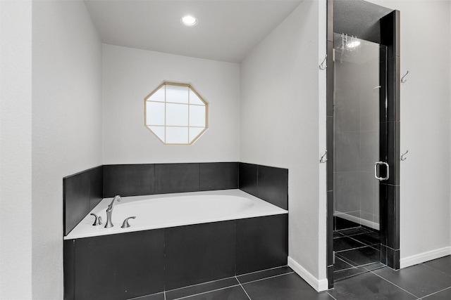 9604 Oak Springs Dr, Woodway, TX 76712 - full bathroom with tile patterned flooring, a garden tub, a stall shower, and recessed lighting