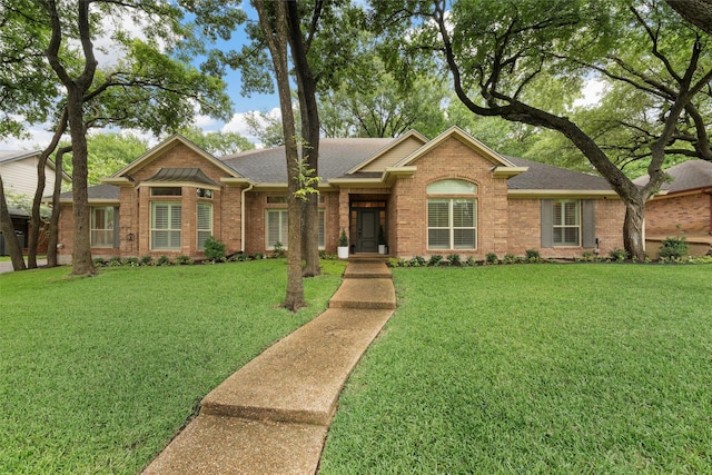 9604 Oak Springs Dr, Woodway, TX 76712 - ranch-style house with a shingled roof, brick siding, and a front yard