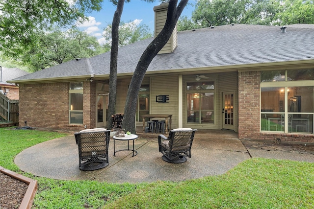 9604 Oak Springs Dr, Woodway, TX 76712 - back of house with brick siding, roof with shingles, and a patio