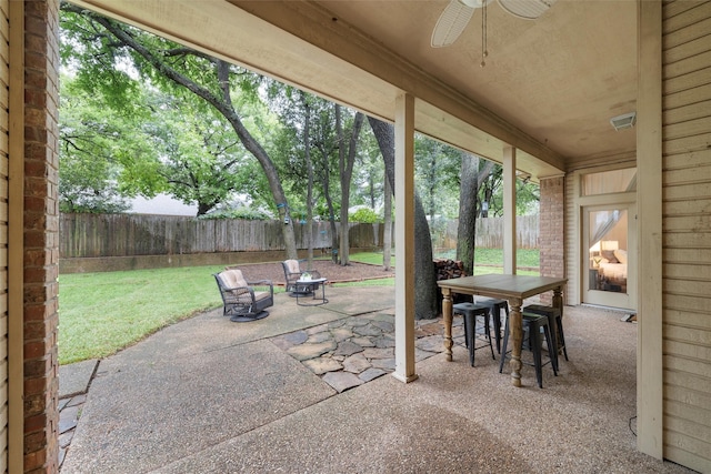 9604 Oak Springs Dr, Woodway, TX 76712 - fenced backyard featuring a ceiling fan, a patio area, and outdoor dining area