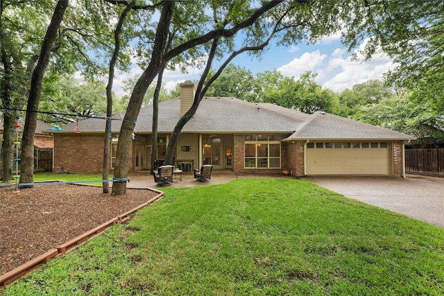9604 Oak Springs Dr, Woodway, TX 76712 - rear view of property with a garage, brick siding, and driveway