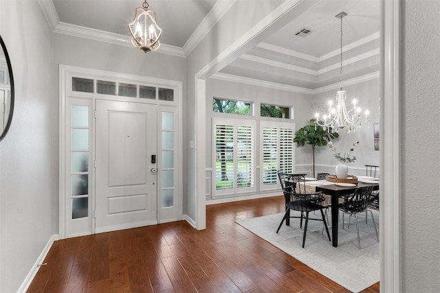 9604 Oak Springs Dr, Woodway, TX 76712 - foyer entrance featuring a chandelier, hardwood / wood-style floors, and ornamental molding