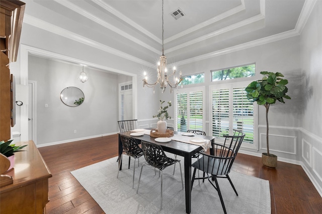 9604 Oak Springs Dr, Woodway, TX 76712 - dining room featuring dark wood-type flooring, a chandelier, a raised ceiling, crown molding, and wainscoting
