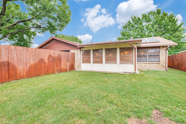 308 Woodhurst Pl, Coppell, TX 75019 - fenced backyard featuring a sunroom