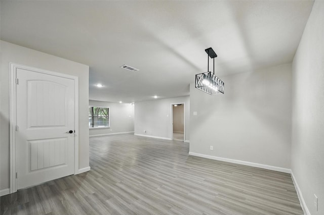 8620 Greenmound Ave, Dallas, TX 75227 - unfurnished room featuring light wood-style floors and recessed lighting