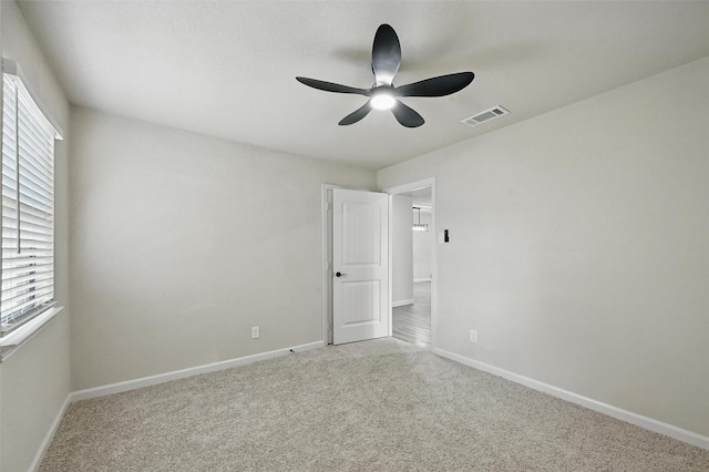8620 Greenmound Ave, Dallas, TX 75227 - empty room featuring a ceiling fan, carpet floors, and healthy amount of natural light