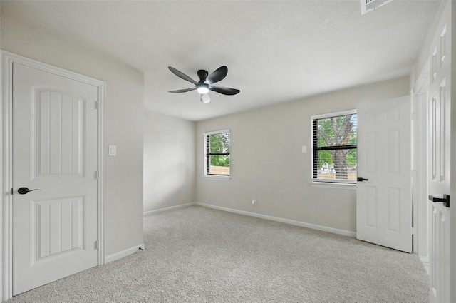 8620 Greenmound Ave, Dallas, TX 75227 - unfurnished bedroom with carpet floors and a ceiling fan