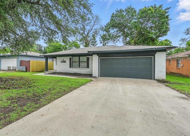 8620 Greenmound Ave, Dallas, TX 75227 - single story home with brick siding, a garage, and driveway