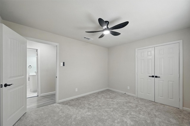 8620 Greenmound Ave, Dallas, TX 75227 - unfurnished bedroom with carpet, a closet, and ceiling fan