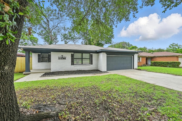 8620 Greenmound Ave, Dallas, TX 75227 - view of front of property featuring brick siding, an attached garage, concrete driveway, and a shingled roof