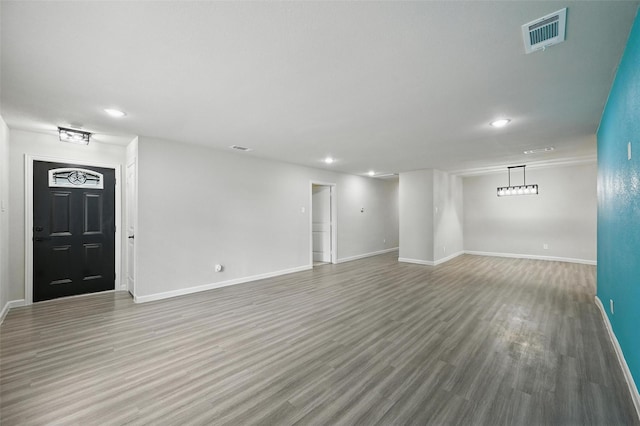 8620 Greenmound Ave, Dallas, TX 75227 - unfurnished living room featuring recessed lighting and wood finished floors