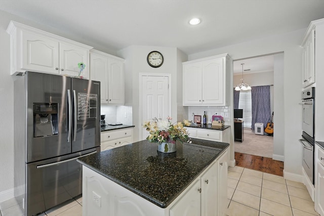 13272 Blue Jean Dr, Fort Worth, TX 76052 - kitchen with stainless steel fridge with ice dispenser, white cabinetry, decorative backsplash, and recessed lighting