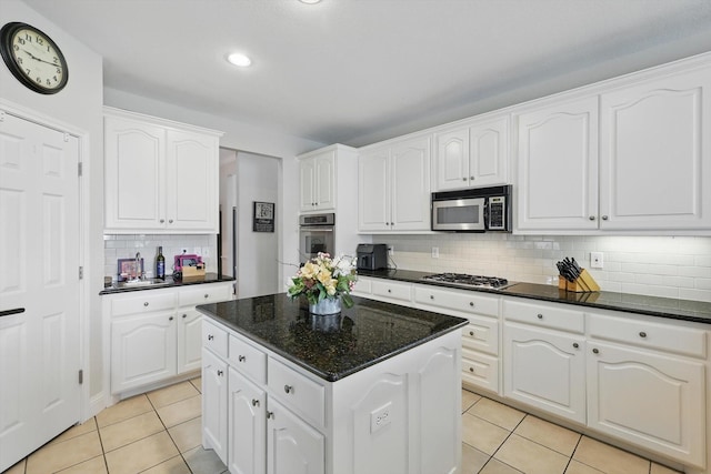 13272 Blue Jean Dr, Fort Worth, TX 76052 - kitchen with stainless steel appliances, light tile patterned floors, tasteful backsplash, a kitchen island, and recessed lighting