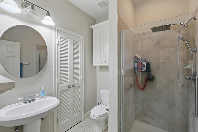 13272 Blue Jean Dr, Fort Worth, TX 76052 - bathroom featuring a closet, a stall shower, and tile patterned floors