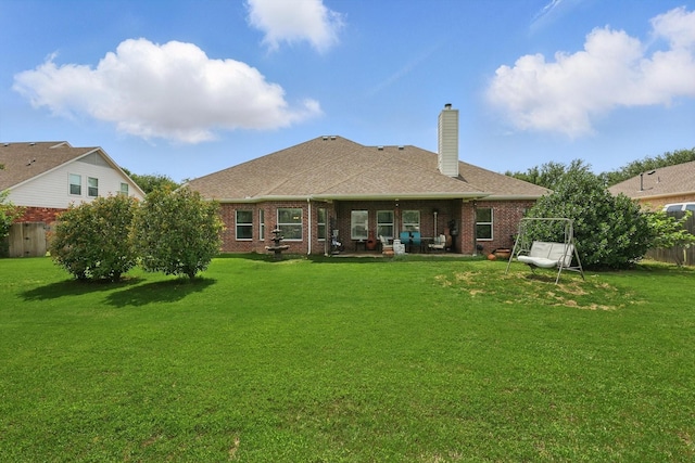 13272 Blue Jean Dr, Fort Worth, TX 76052 - rear view of property featuring a chimney, brick siding, a shingled roof, and a patio