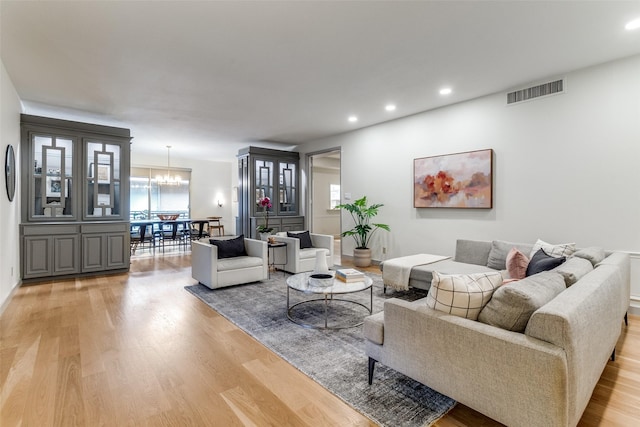 6328 Bandera Ave Unit C, Dallas, TX 75225 - living room featuring light wood-style flooring, healthy amount of natural light, a chandelier, and recessed lighting