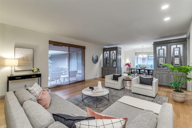 6328 Bandera Ave Unit C, Dallas, TX 75225 - living room featuring light wood-style floors, a chandelier, and recessed lighting