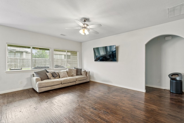 1108 Sheldon Dr, Anna, TX 75409 - living area with arched walkways, ceiling fan, and wood finished floors