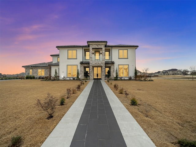7604 Nocona Dr, Parker, TX 75098 - view of front of house featuring stone siding, stucco siding, and a tile roof