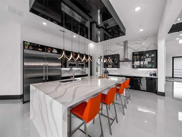 7604 Nocona Dr, Parker, TX 75098 - kitchen with stainless steel built in fridge, wall chimney exhaust hood, recessed lighting, dark cabinetry, and open shelves