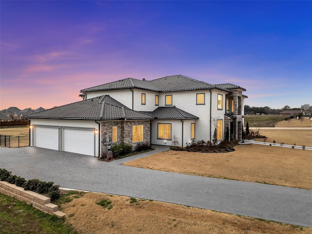 7604 Nocona Dr, Parker, TX 75098 - view of front of house with an attached garage, asphalt driveway, stucco siding, stone siding, and a tiled roof