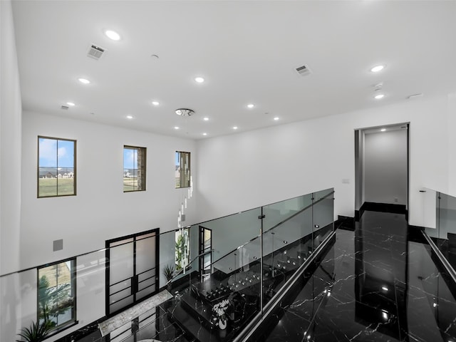 7604 Nocona Dr, Parker, TX 75098 - stairway featuring recessed lighting and marble tiled flooring