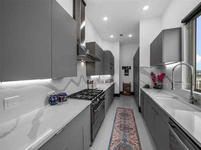 7604 Nocona Dr, Parker, TX 75098 - kitchen featuring range with two ovens, modern cabinets, wall chimney exhaust hood, stainless steel dishwasher, and gray cabinets