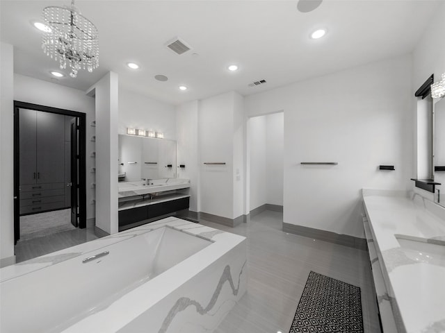 7604 Nocona Dr, Parker, TX 75098 - bathroom with double vanity, a tub to relax in, recessed lighting, and a chandelier