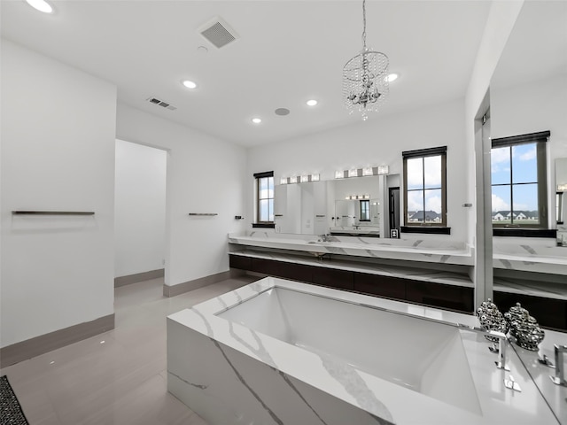 7604 Nocona Dr, Parker, TX 75098 - full bathroom featuring recessed lighting, double vanity, a chandelier, and a bath