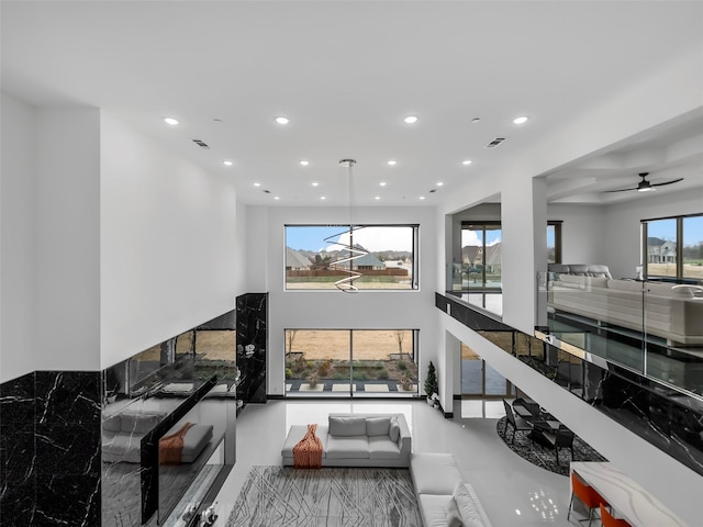 7604 Nocona Dr, Parker, TX 75098 - living area featuring recessed lighting, a high ceiling, and a ceiling fan